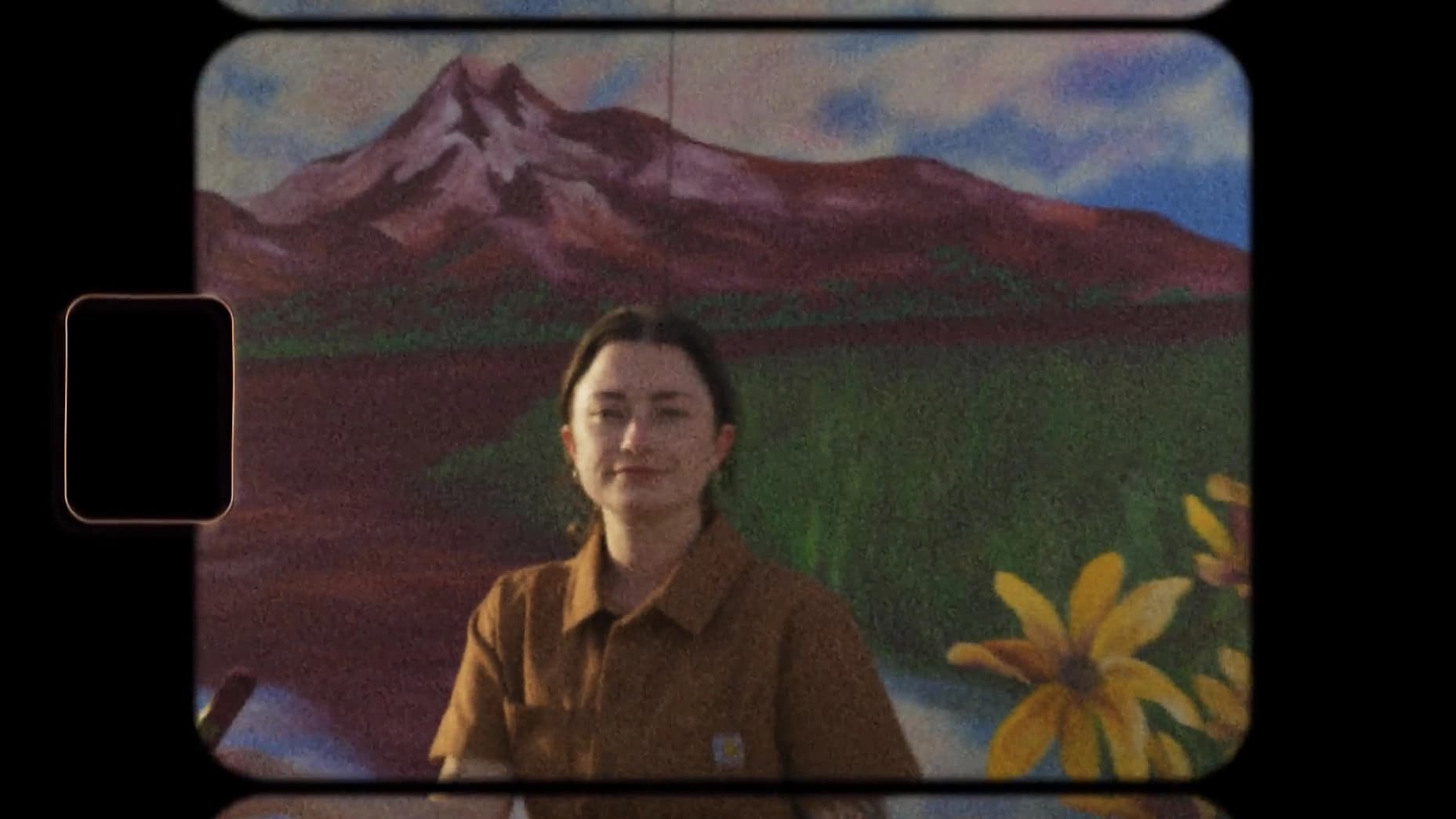 Woman standing by flowers