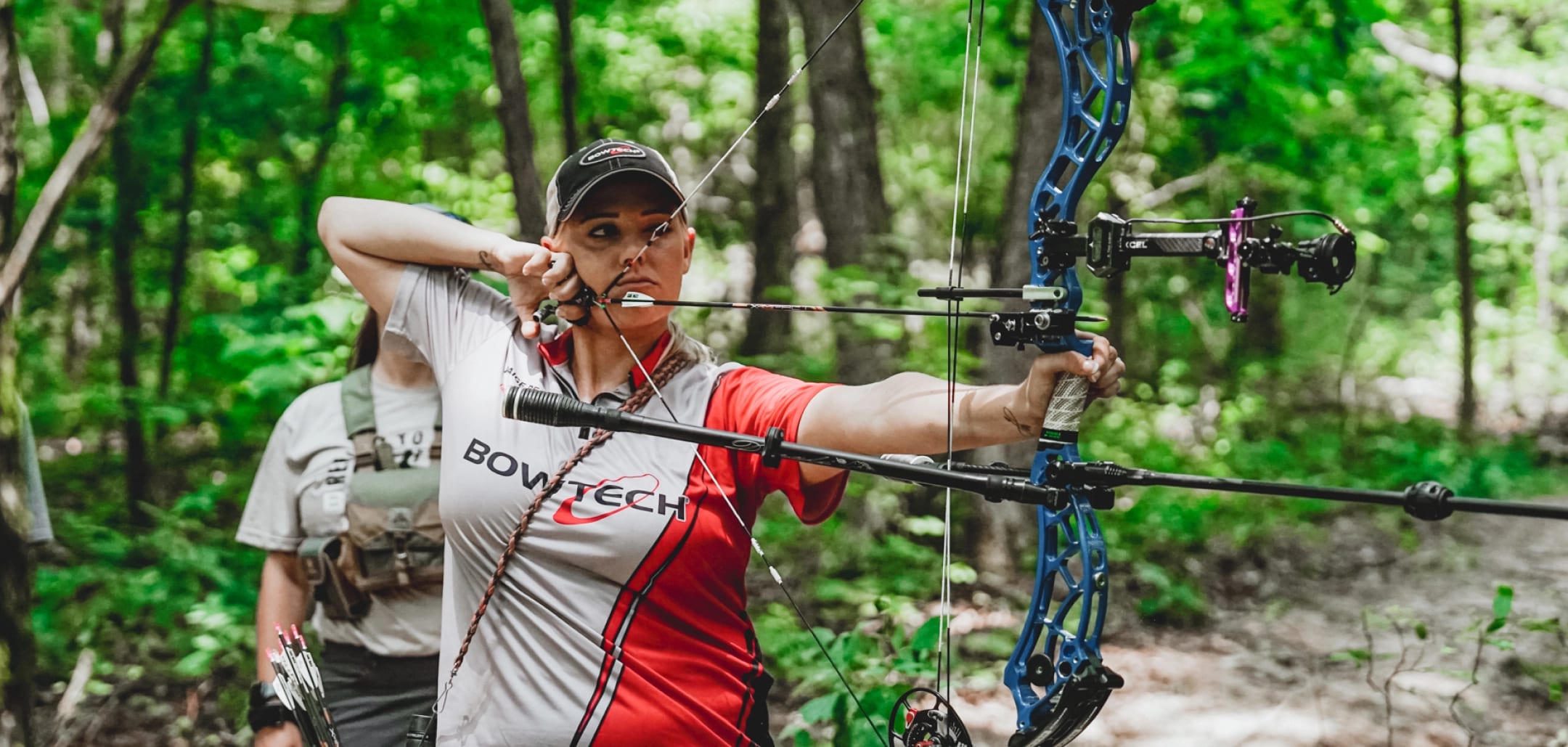 Bowtech person shooting a bow and arrow