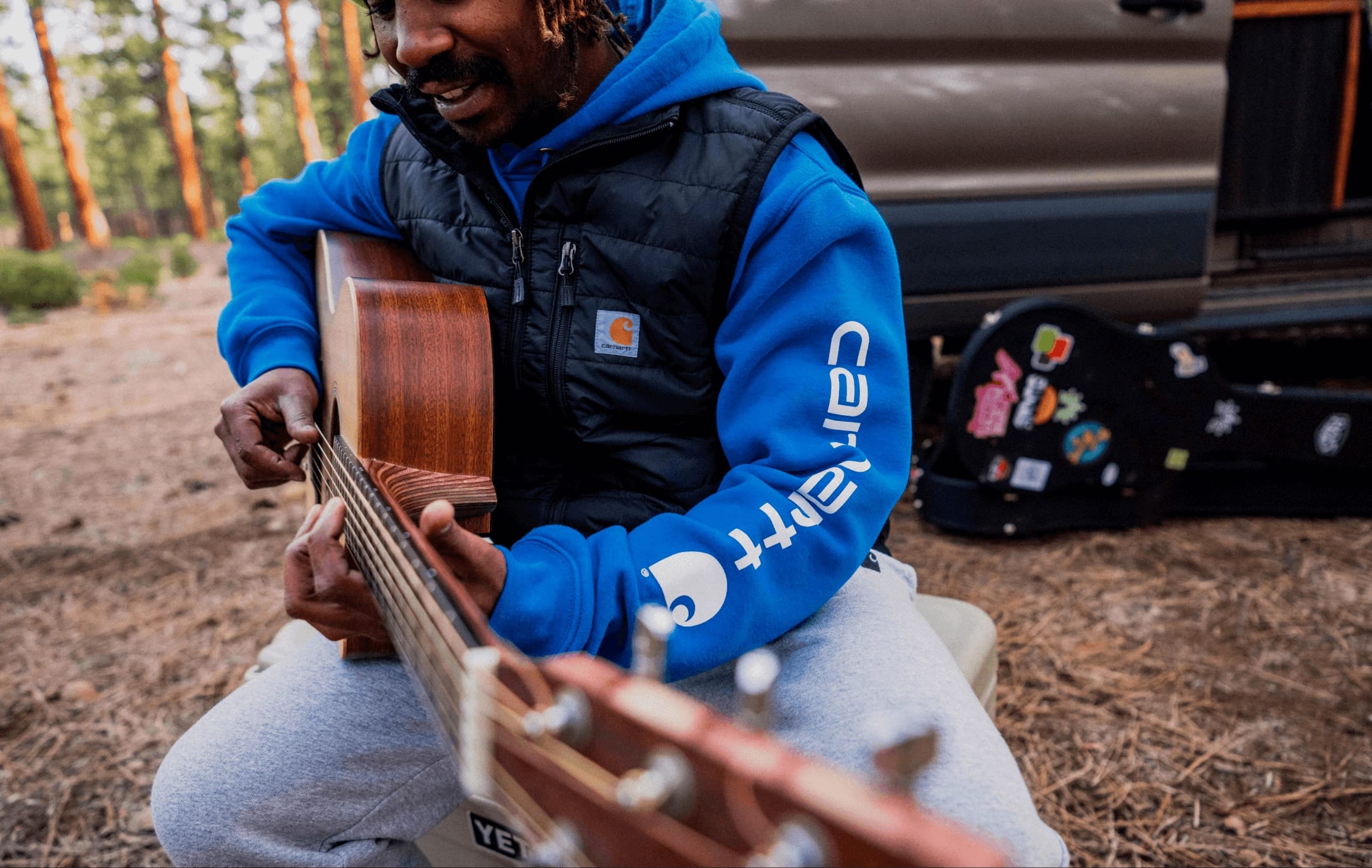 Carhartt playing a guitar