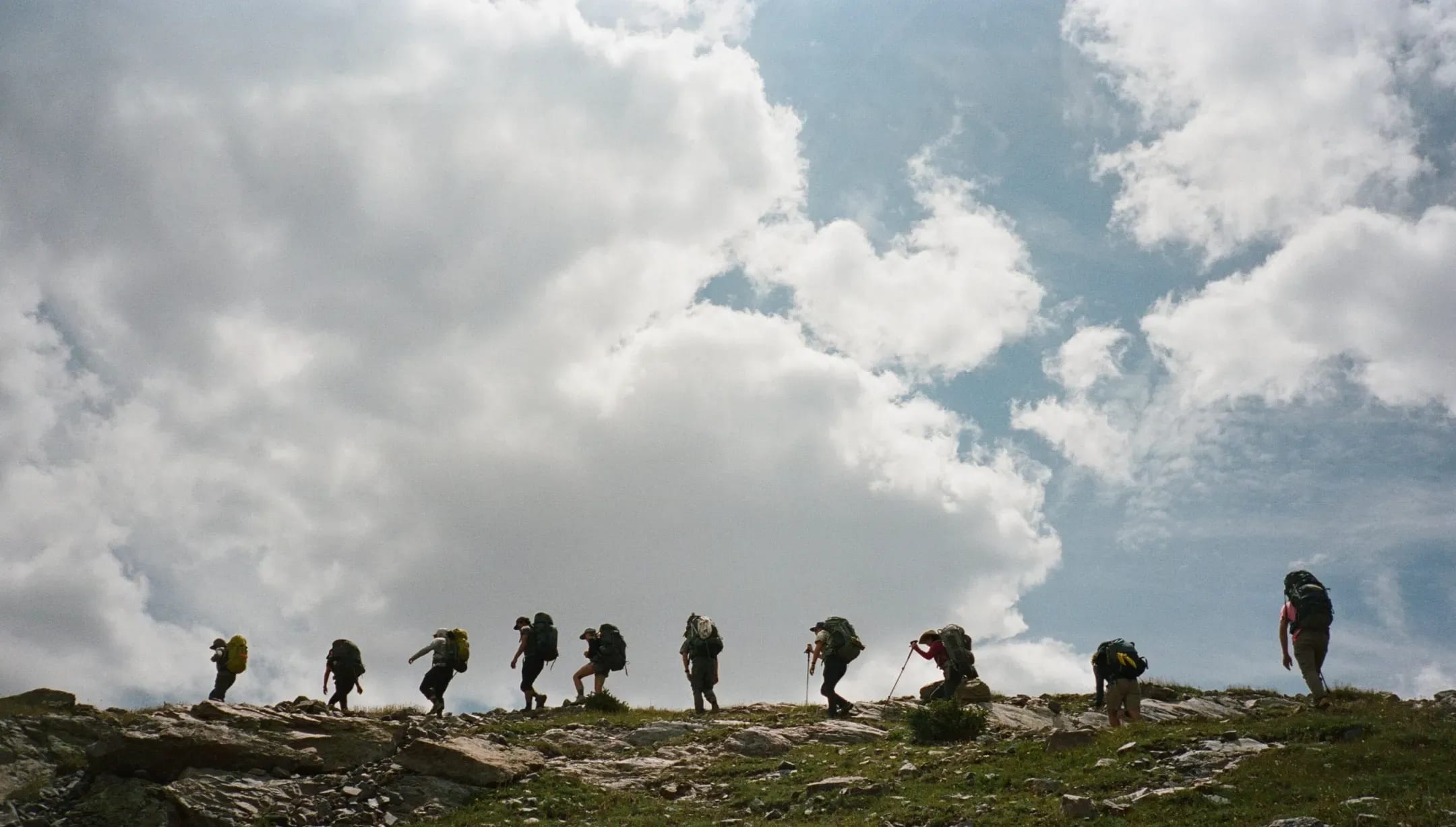 A group of hikers on top of a mountain